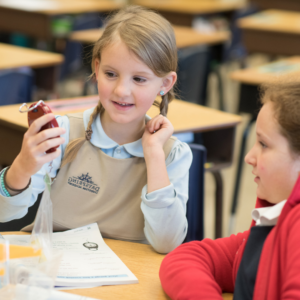 Two Dayspring lower school girl students solving a class problem together